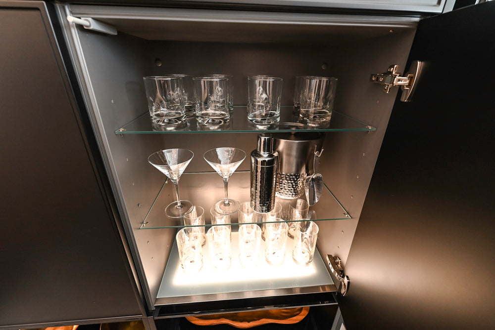 Nolte Küchen Modern Black Kitchen with Unique Accent Wall Cabinetry