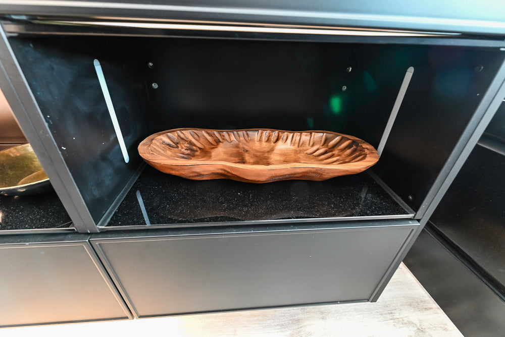 Nolte Küchen Modern Black Kitchen with Unique Accent Wall Cabinetry