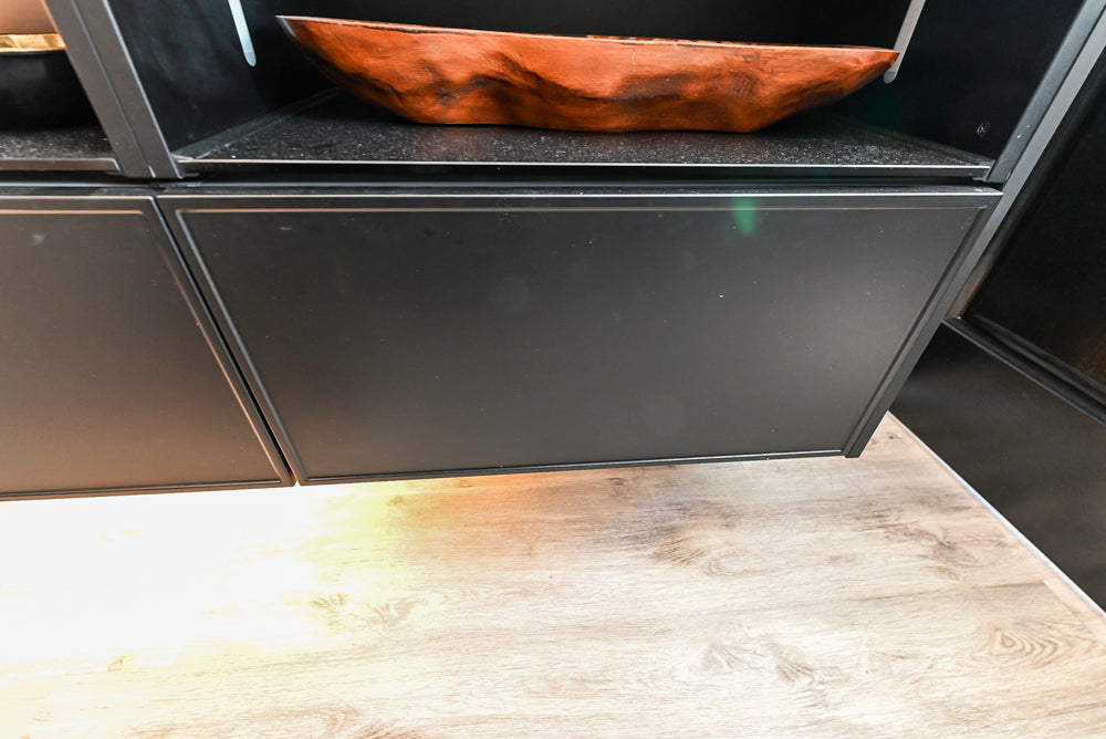 Nolte Küchen Modern Black Kitchen with Unique Accent Wall Cabinetry