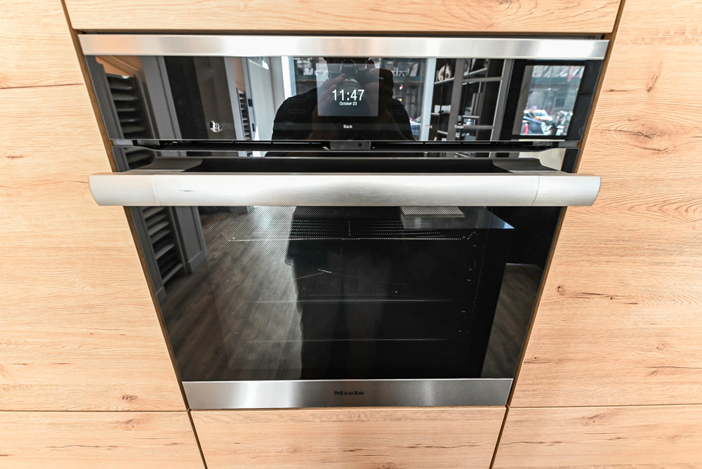 Nolte Küchen Modern Black Kitchen with Unique Accent Wall Cabinetry
