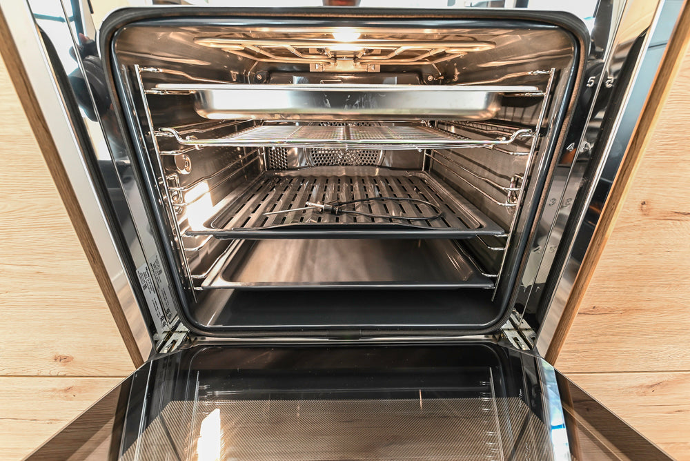 Nolte Küchen Modern Black Kitchen with Unique Accent Wall Cabinetry