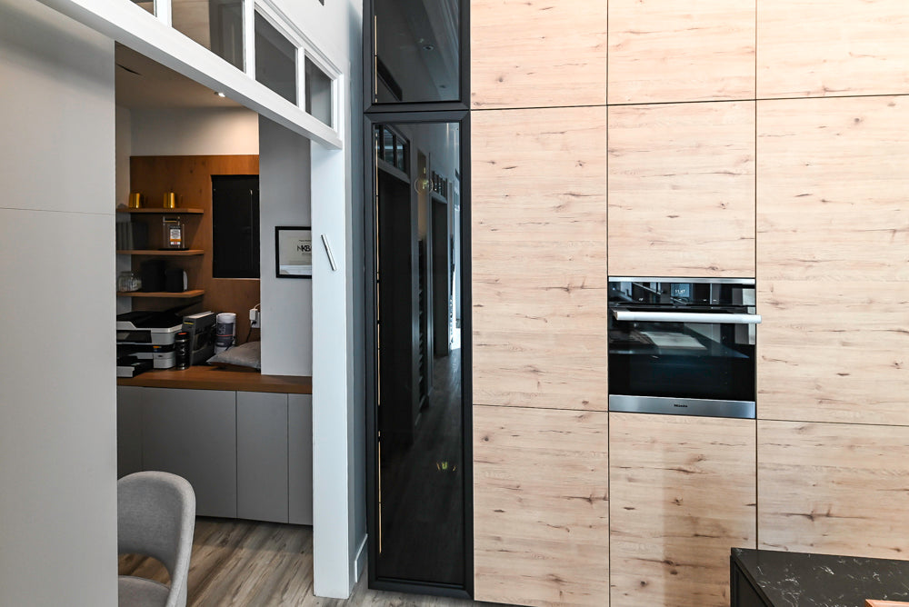 Nolte Küchen Modern Black Kitchen with Unique Accent Wall Cabinetry