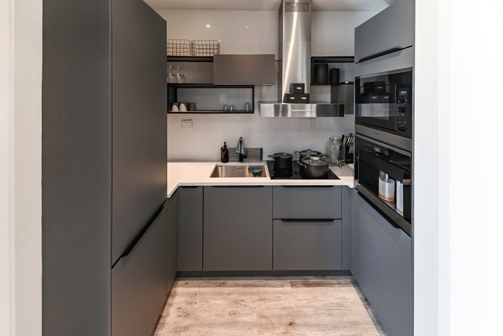 Modern Dark Grey Kitchenette with Quartz Countertops and Miele Appliances