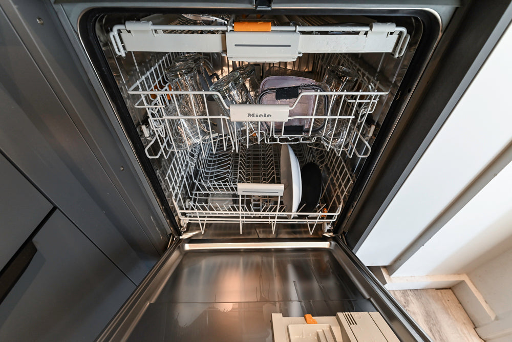 Modern Dark Grey Kitchenette with Quartz Countertops and Miele Appliances