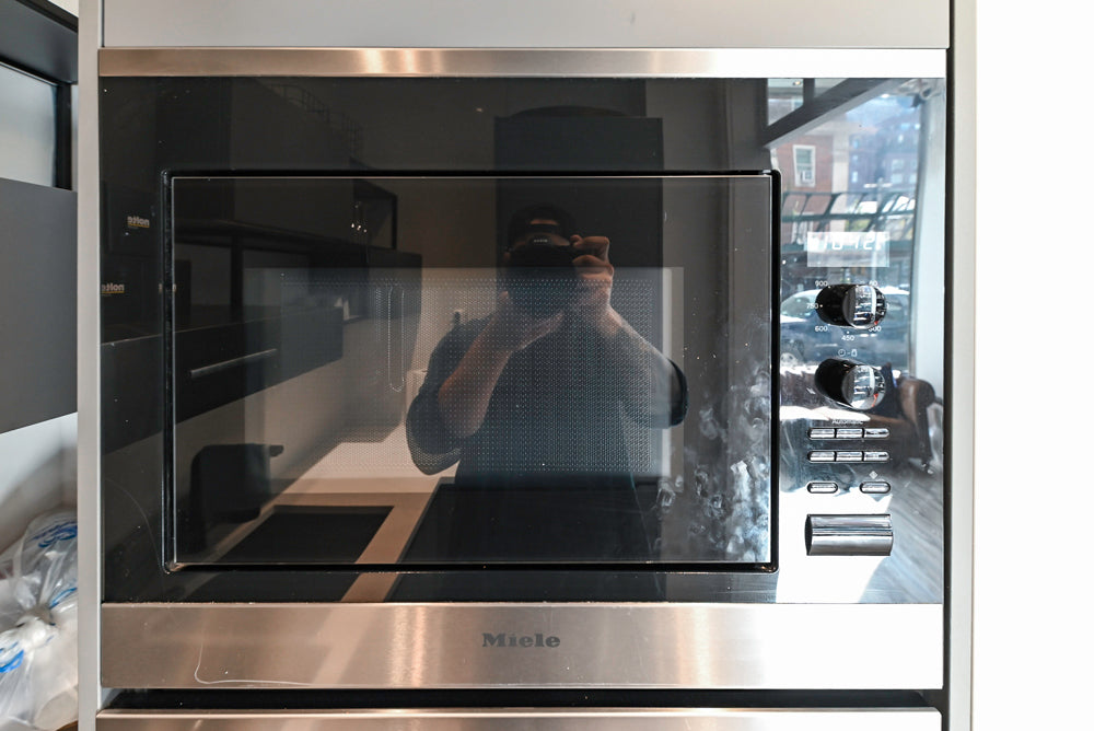 Modern Dark Grey Kitchenette with Quartz Countertops & Miele Appliances