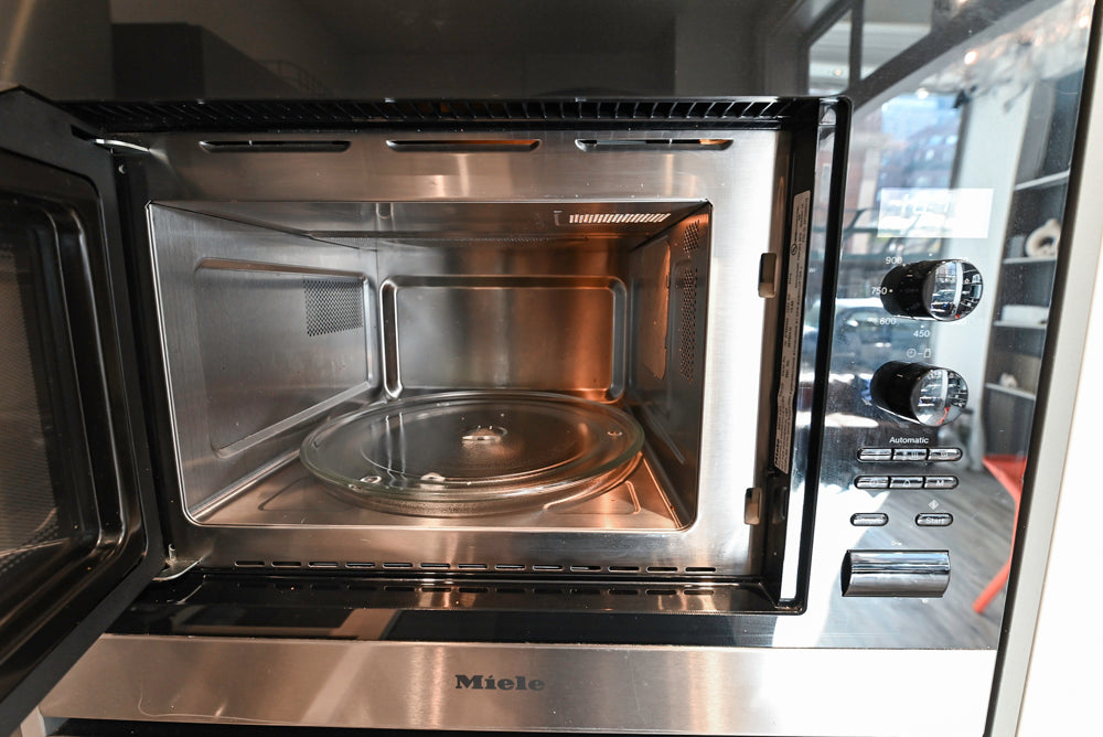 Modern Dark Grey Kitchenette with Quartz Countertops & Miele Appliances