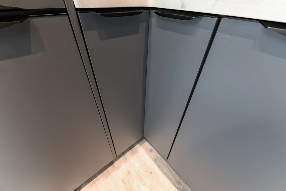 Modern Dark Grey Kitchenette with Quartz Countertops & Miele Appliances