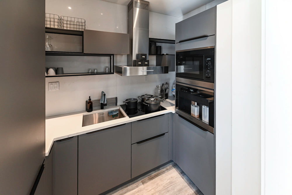 Modern Dark Grey Kitchenette with Quartz Countertops and Miele Appliances