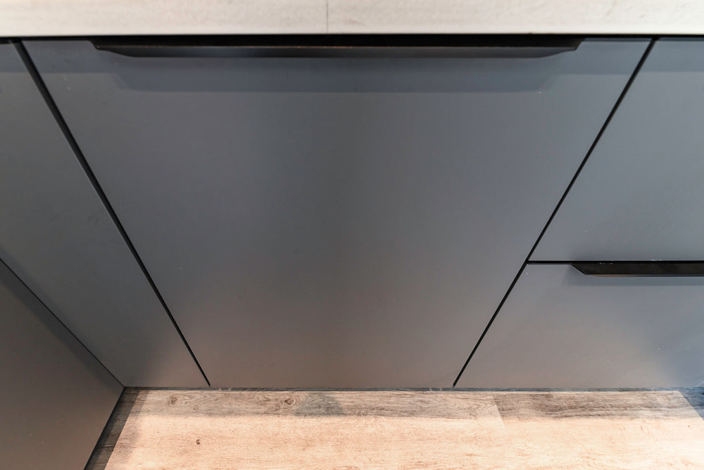 Modern Dark Grey Kitchenette with Quartz Countertops & Miele Appliances