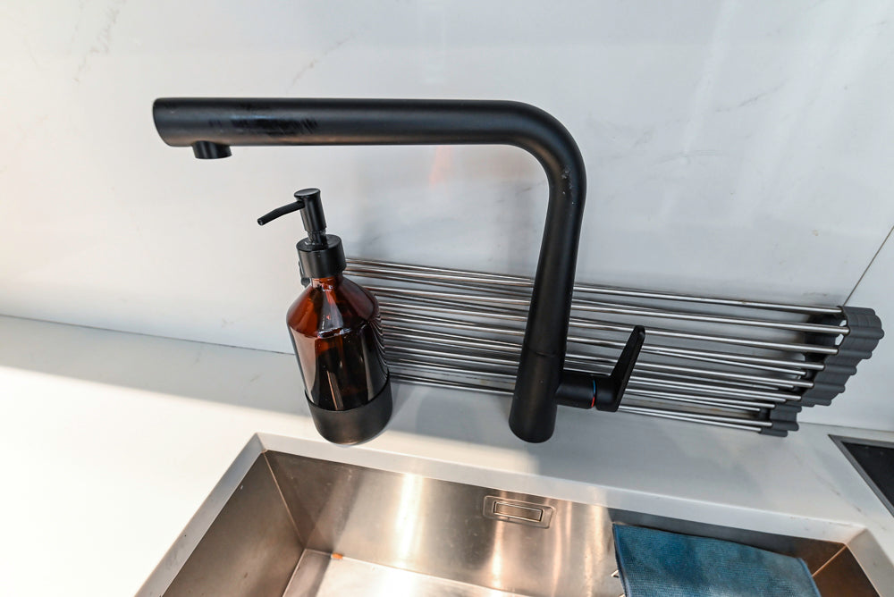 Modern Dark Grey Kitchenette with Quartz Countertops & Miele Appliances