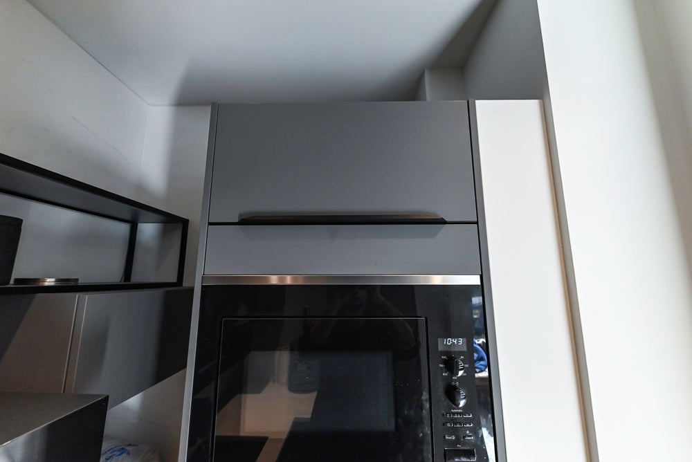 Modern Dark Grey Kitchenette with Quartz Countertops & Miele Appliances