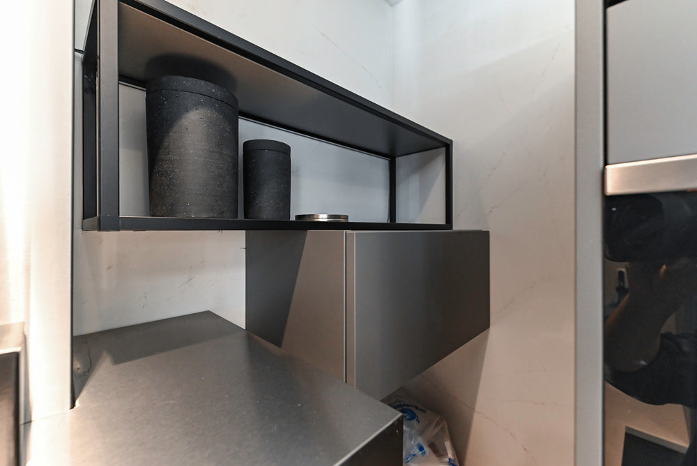 Modern Dark Grey Kitchenette with Quartz Countertops & Miele Appliances