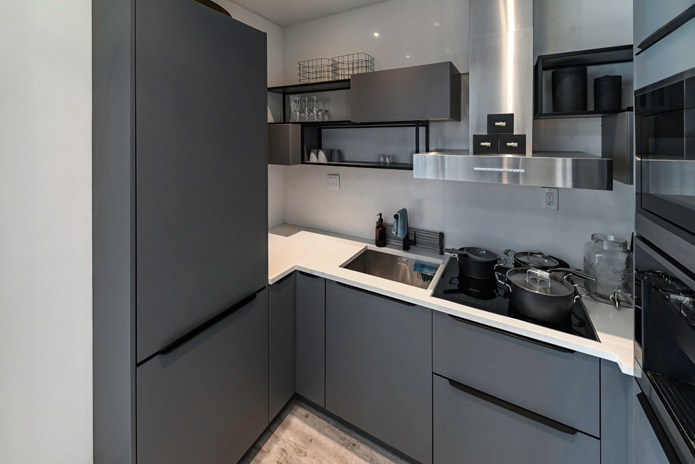 Modern Dark Grey Kitchenette with Quartz Countertops and Miele Appliances