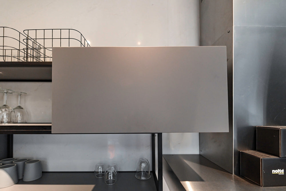 Modern Dark Grey Kitchenette with Quartz Countertops & Miele Appliances