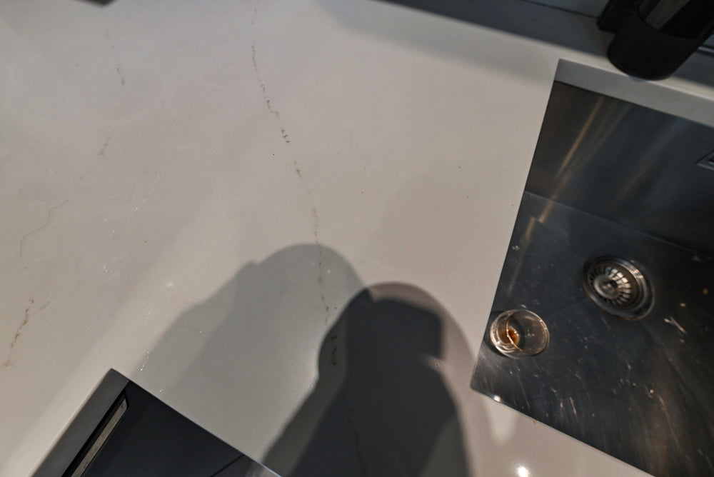 Modern Dark Grey Kitchenette with Quartz Countertops & Miele Appliances