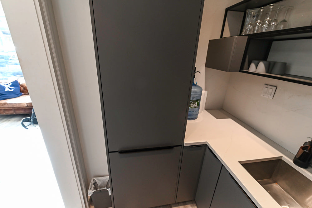 Modern Dark Grey Kitchenette with Quartz Countertops and Miele Appliances