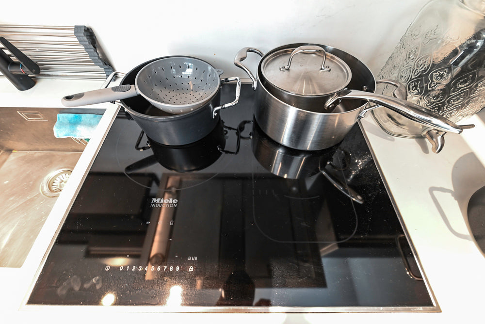 Modern Dark Grey Kitchenette with Quartz Countertops and Miele Appliances