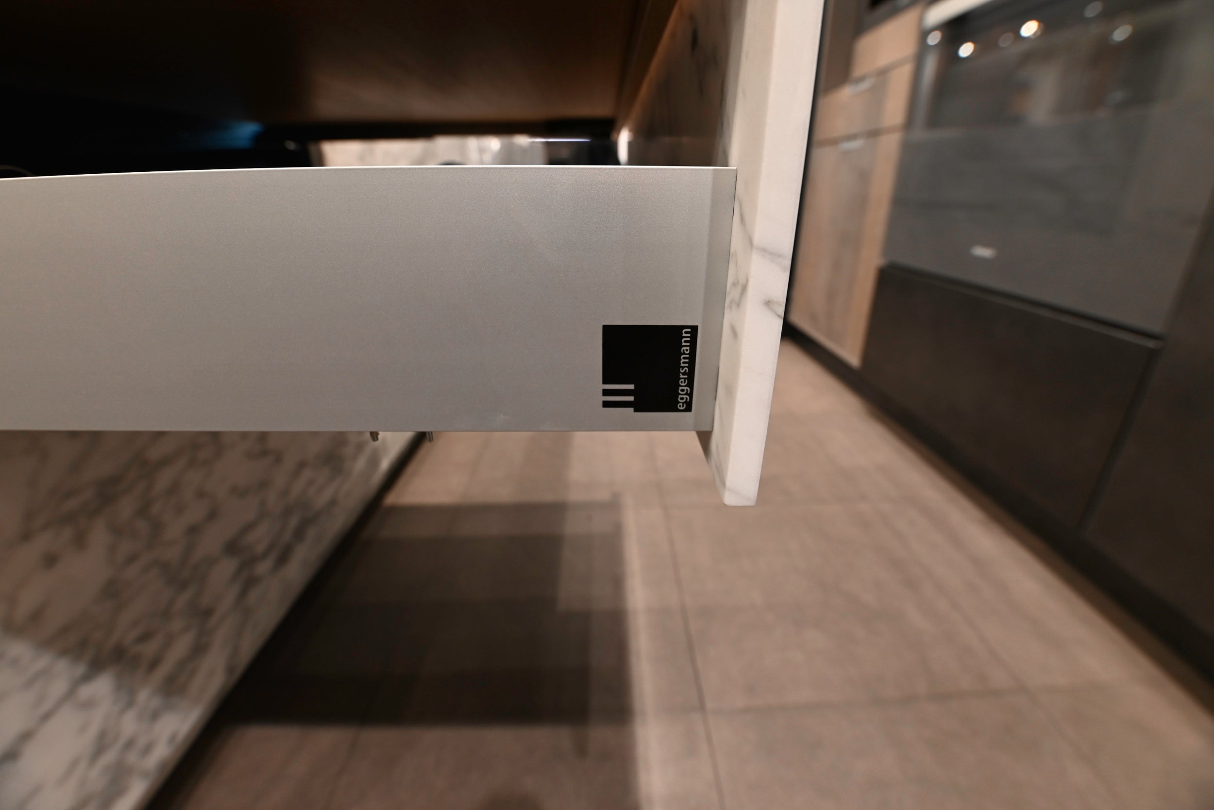 eggersmann USA Chablis Vintage Oak & Steel Grey Modern Kitchen with Arabescato Waterfall Island and Miele Appliance Suite
