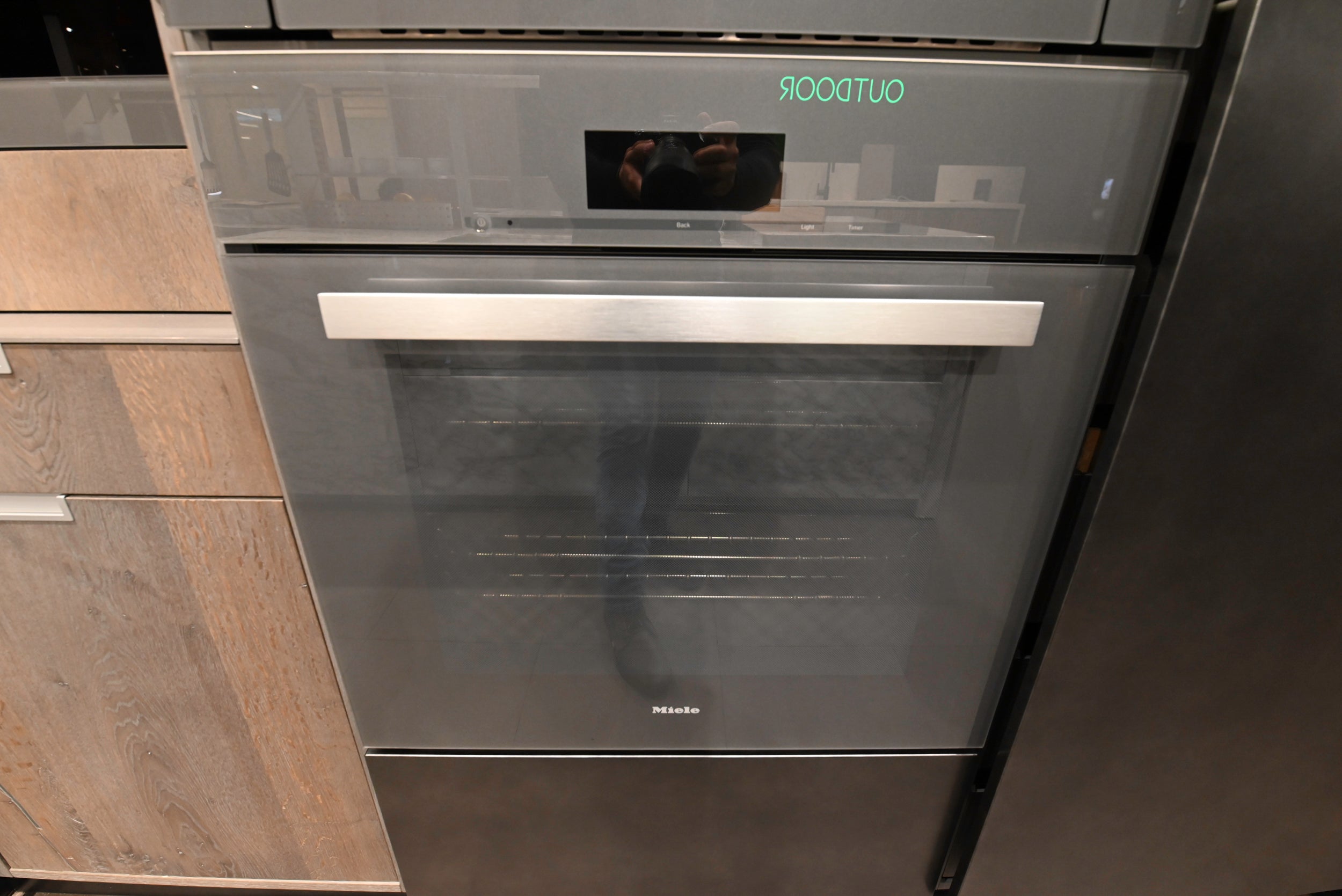 eggersmann USA Chablis Vintage Oak & Steel Grey Modern Kitchen with Arabescato Waterfall Island and Miele Appliance Suite
