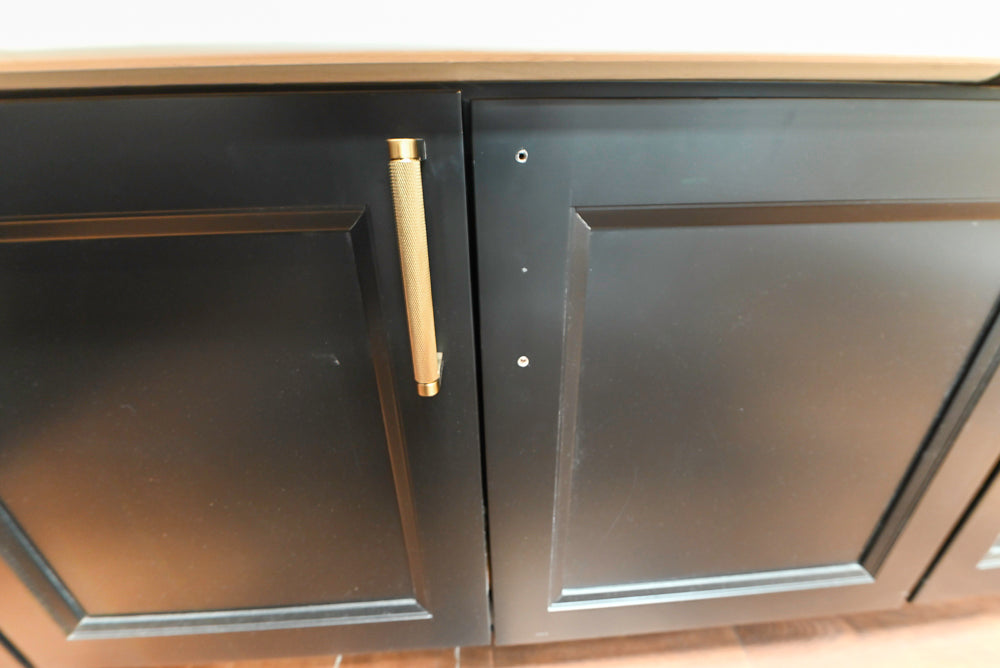 Showplace Black and White Industrial Kitchen with Island and Bonus Bench Area