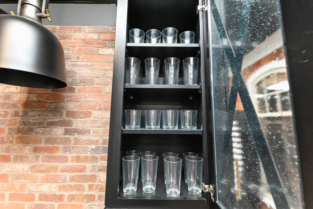 Showplace Black and White Industrial Kitchen with Island and Bonus Bench Area