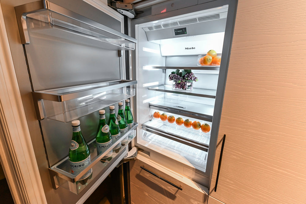 Modern White and Brown Wood Veneer Kitchen with Waterfall Island, Marble Countertops & Miele Appliances