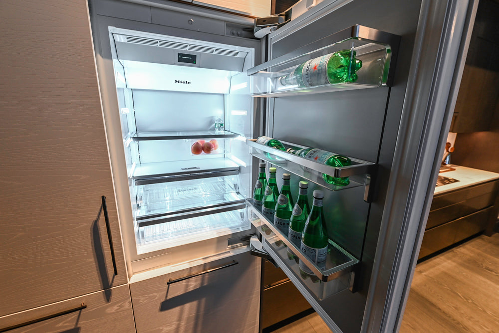 Modern White and Brown Wood Veneer Kitchen with Waterfall Island, Marble Countertops & Miele Appliances