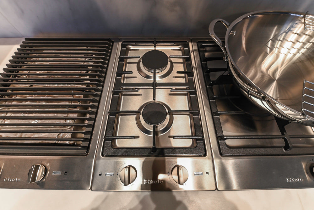 Modern White and Brown Wood Veneer Kitchen with Waterfall Island, Marble Countertops & Miele Appliances