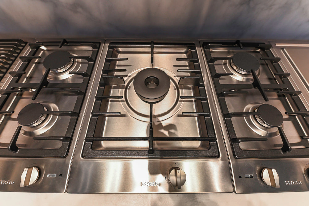 Modern White and Brown Wood Veneer Kitchen with Waterfall Island, Marble Countertops & Miele Appliances