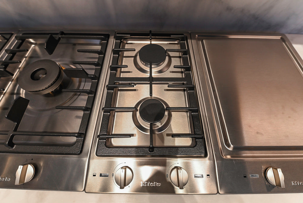 Modern White and Brown Wood Veneer Kitchen with Waterfall Island, Marble Countertops & Miele Appliances