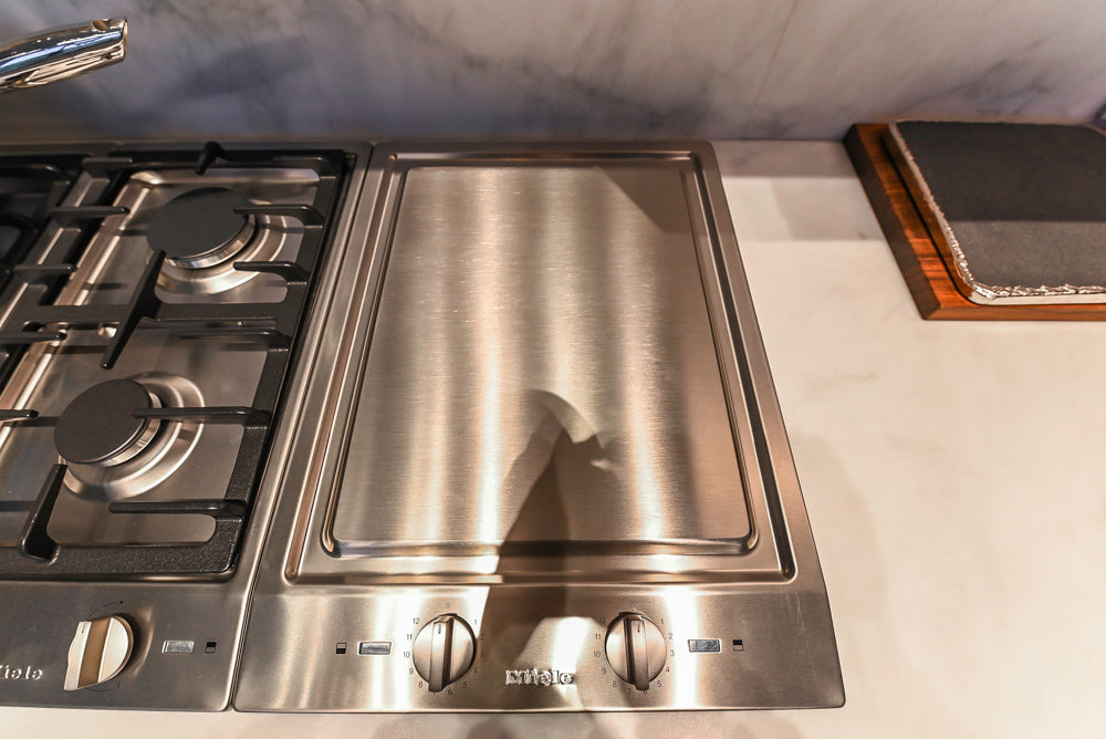 Modern White and Brown Wood Veneer Kitchen with Waterfall Island, Marble Countertops & Miele Appliances