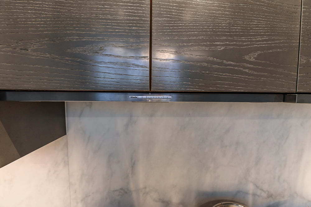 Modern White and Brown Wood Veneer Kitchen with Waterfall Island, Marble Countertops & Miele Appliances