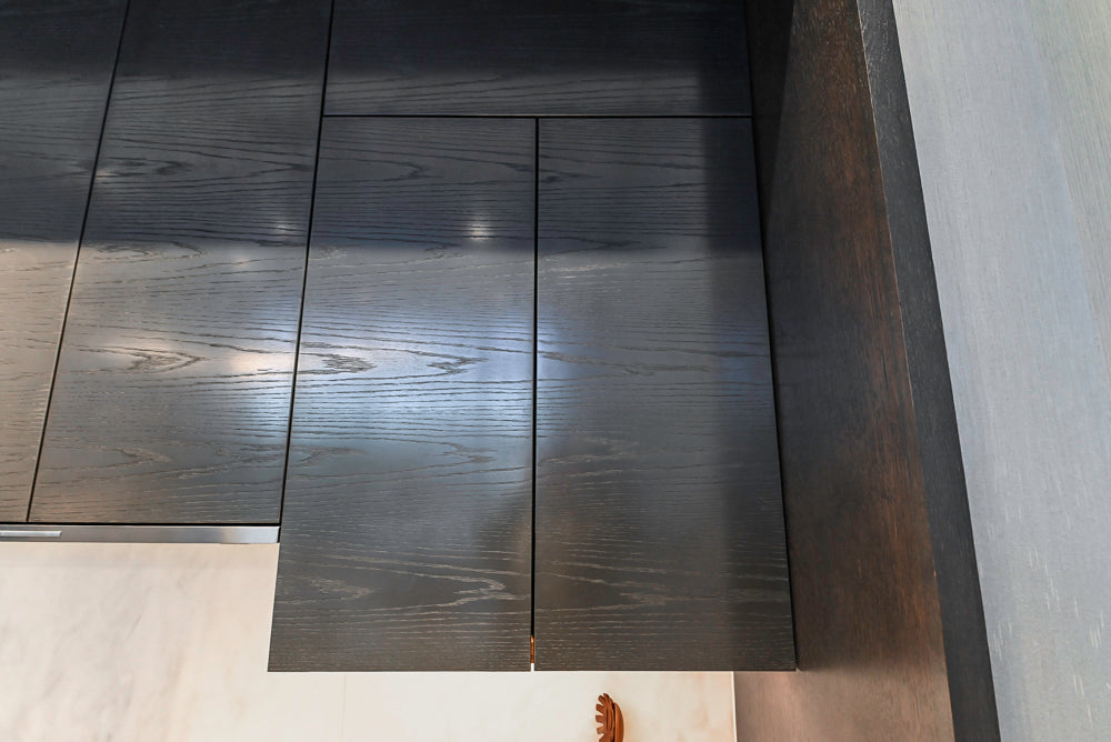 Modern White and Brown Wood Veneer Kitchen with Waterfall Island, Marble Countertops & Miele Appliances