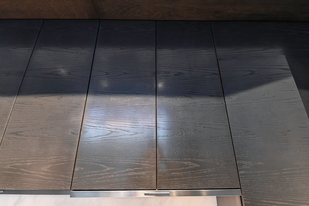 Modern White and Brown Wood Veneer Kitchen with Waterfall Island, Marble Countertops & Miele Appliances