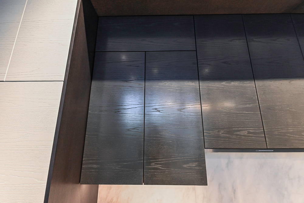 Modern White and Brown Wood Veneer Kitchen with Waterfall Island, Marble Countertops & Miele Appliances