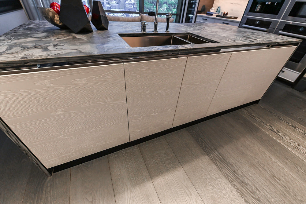 Modern White and Brown Wood Veneer Kitchen with Waterfall Island, Marble Countertops & Miele Appliances