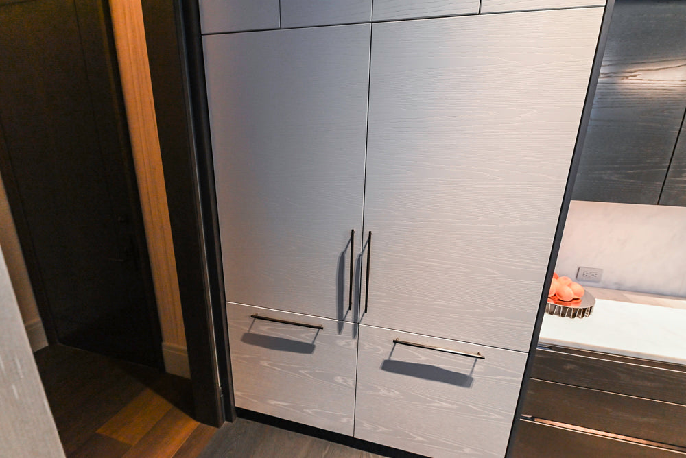 Modern White and Brown Wood Veneer Kitchen with Waterfall Island, Marble Countertops & Miele Appliances