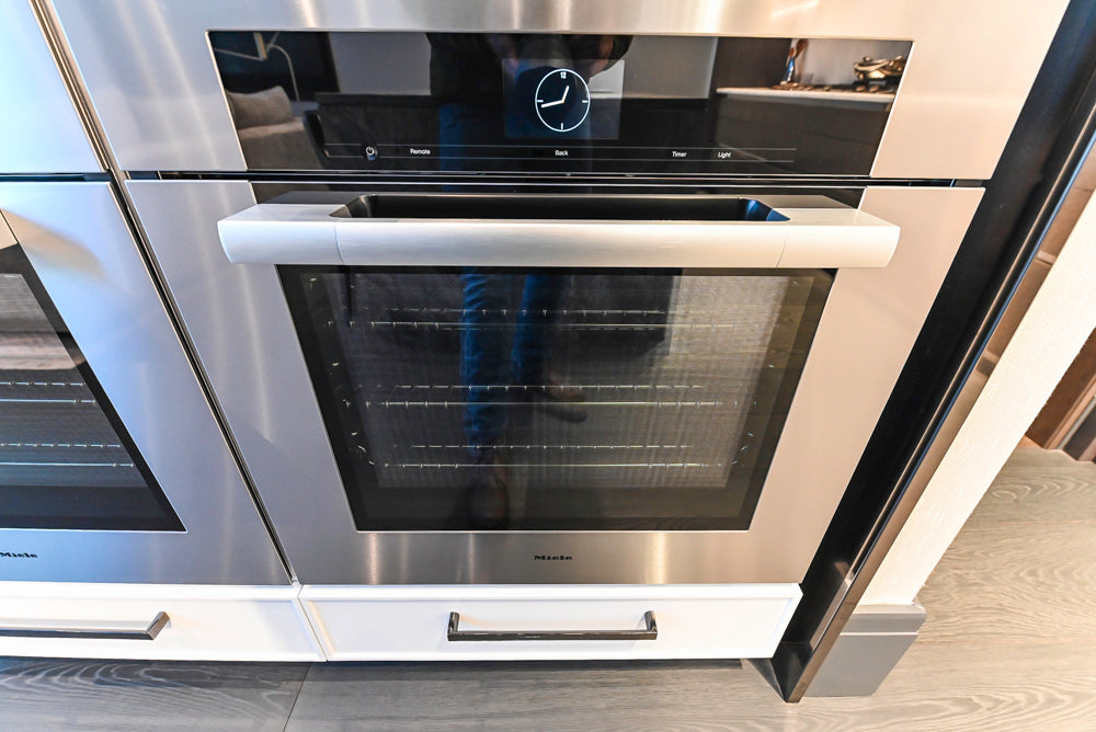 Transitional White Kitchen with Marble Countertops & Miele Appliances