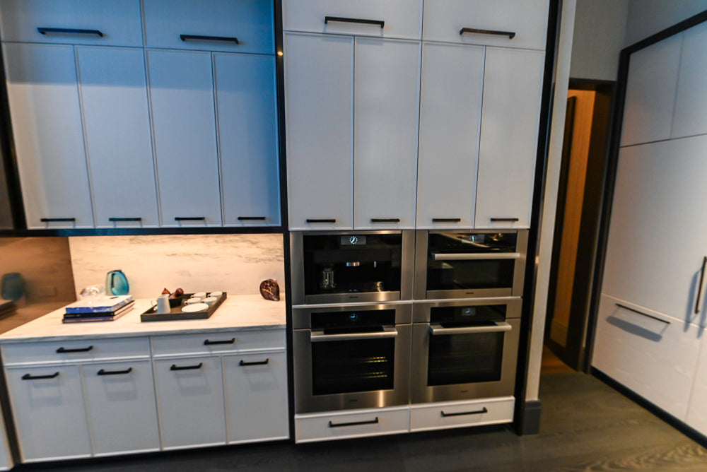 Transitional White Kitchen with Marble Countertops & Miele Appliances