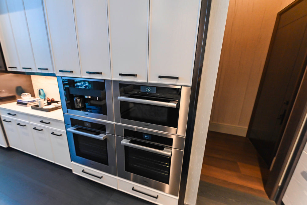 Transitional White Kitchen with Marble Countertops & Miele Appliances