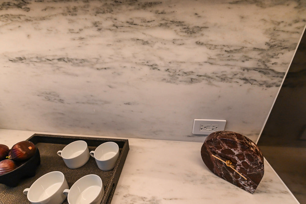 Transitional White Kitchen with Marble Countertops & Miele Appliances