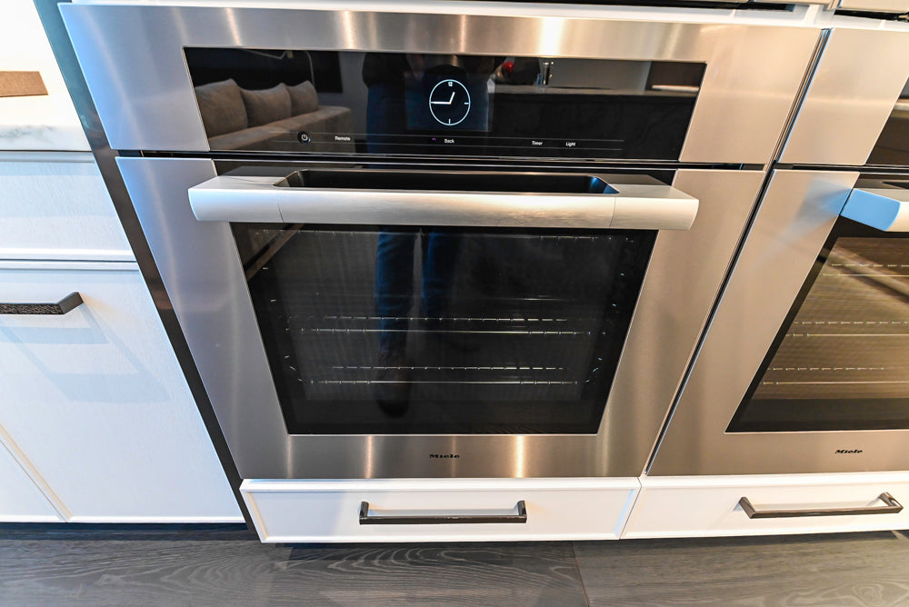 Transitional White Kitchen with Marble Countertops & Miele Appliances