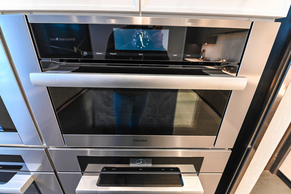 Transitional White Kitchen with Marble Countertops & Miele Appliances