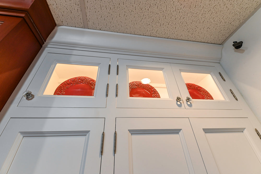 Amish Custom Cabinets with Mahogany Hood in Traditional Classic White Kitchen & Two-Toned Dry Bar