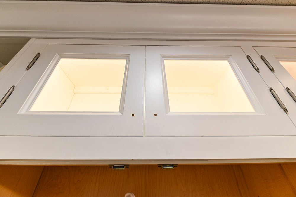 Amish Custom Cabinets with Mahogany Hood in Traditional Classic White Kitchen & Two-Toned Dry Bar