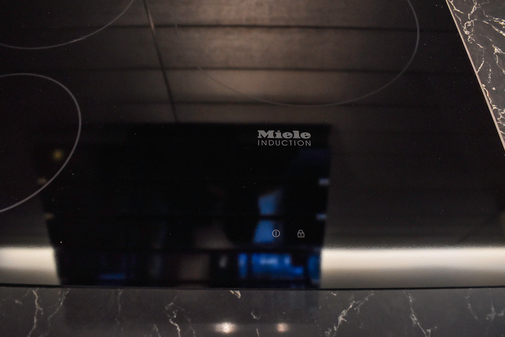 Poggenpohl Segmento Modern Black Kitchen with Miele Appliances