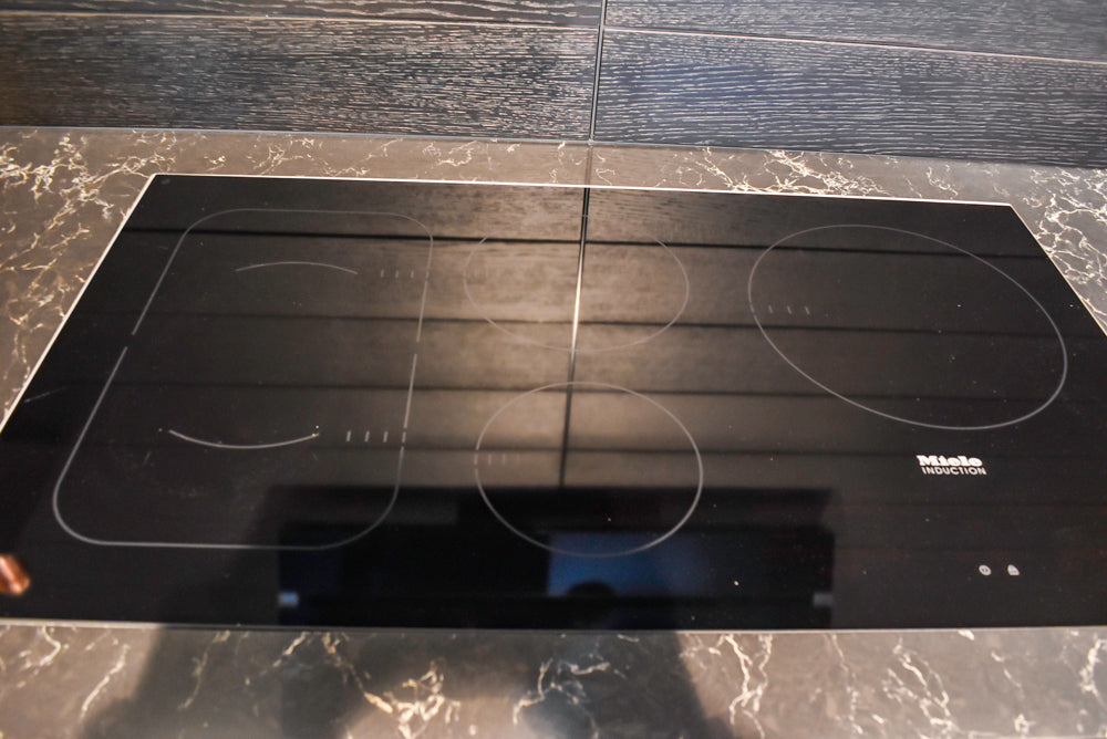 Poggenpohl Segmento Modern Black Kitchen with Miele Appliances