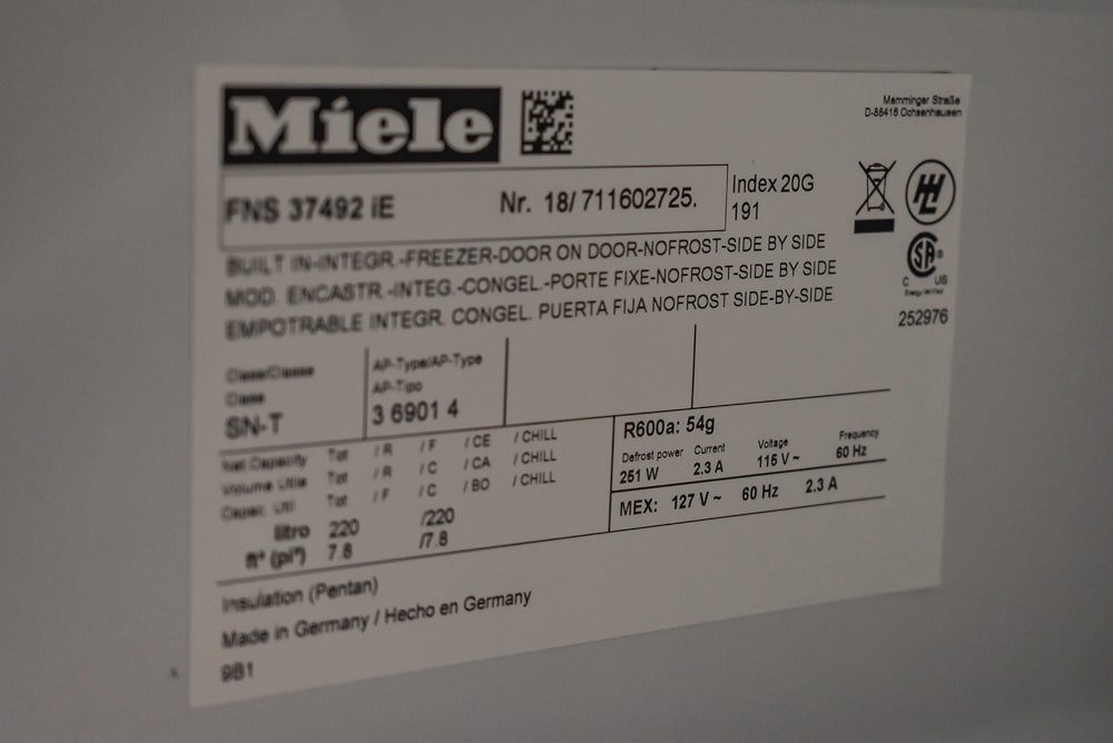 Poggenpohl Segmento Modern Black Kitchen with Miele Appliances