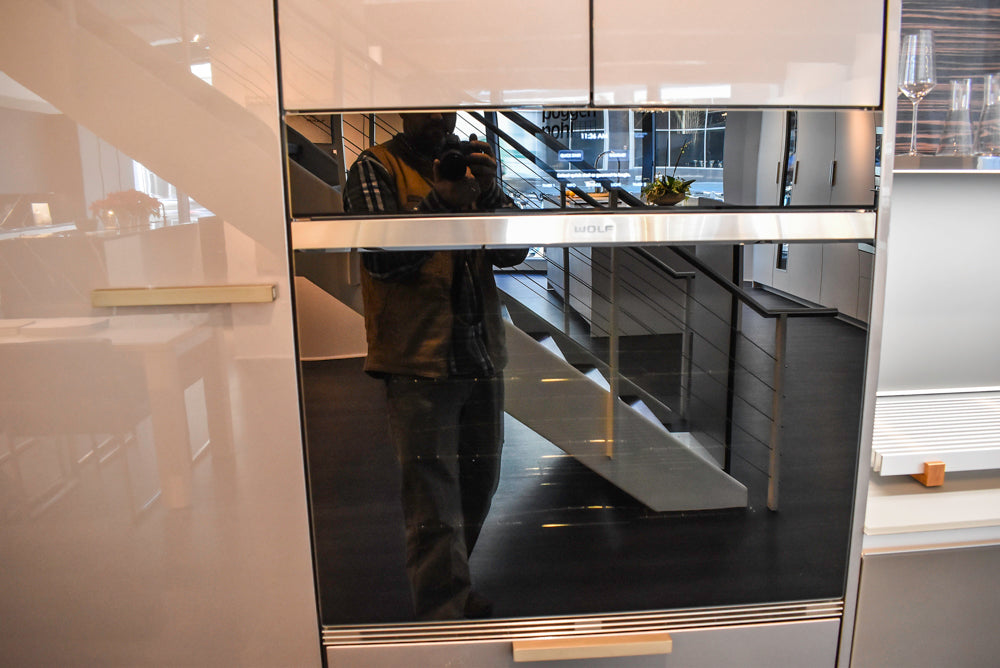 Poggenpohl Standard Modern Multi-Tone Kitchen with Glass Upper Cabinets and Sub-Zero & Wolf Appliances