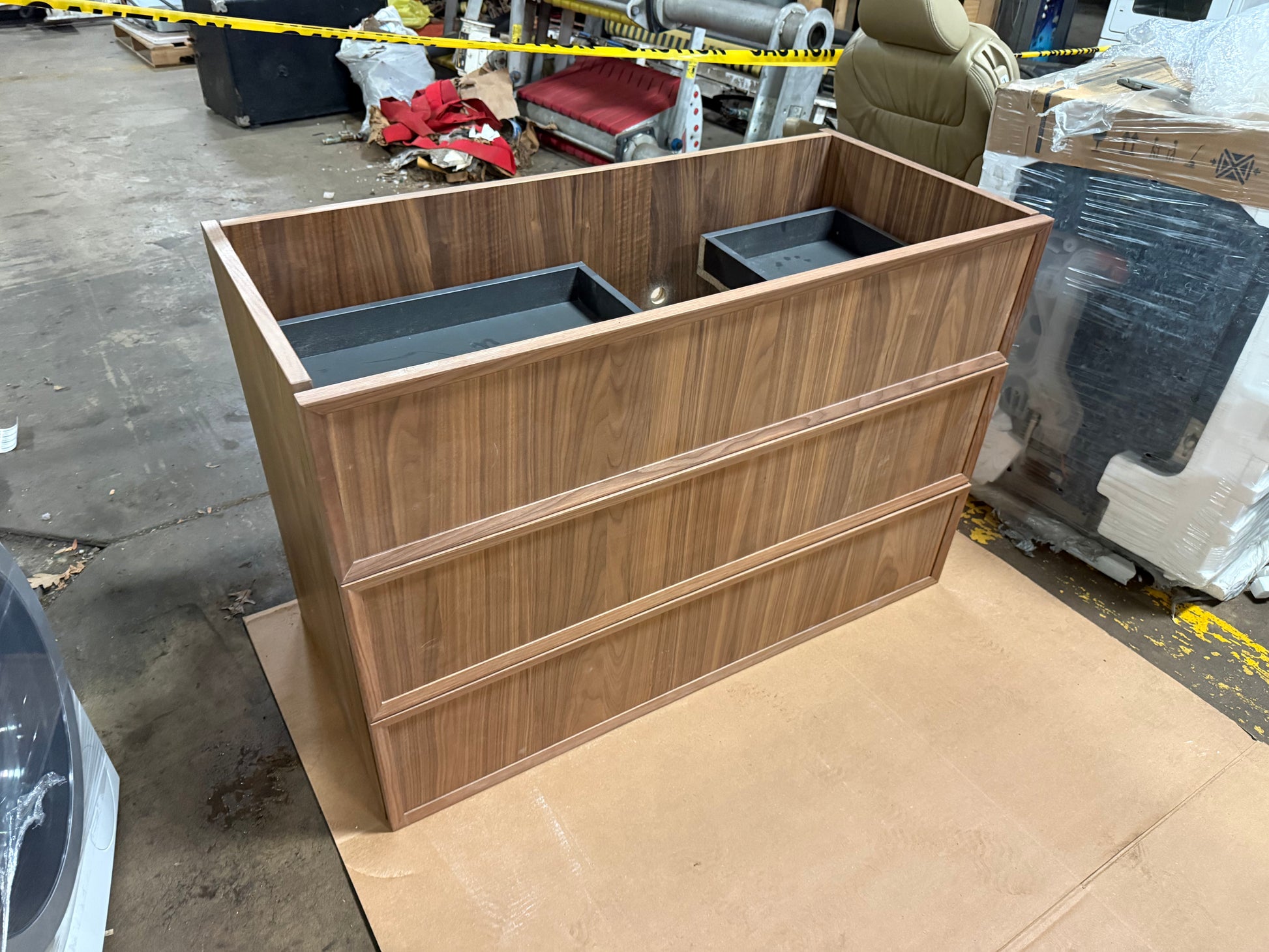 close up view of the honey-toned natural walnut wood grain on a DOCA 39 inch bathroom vanity base